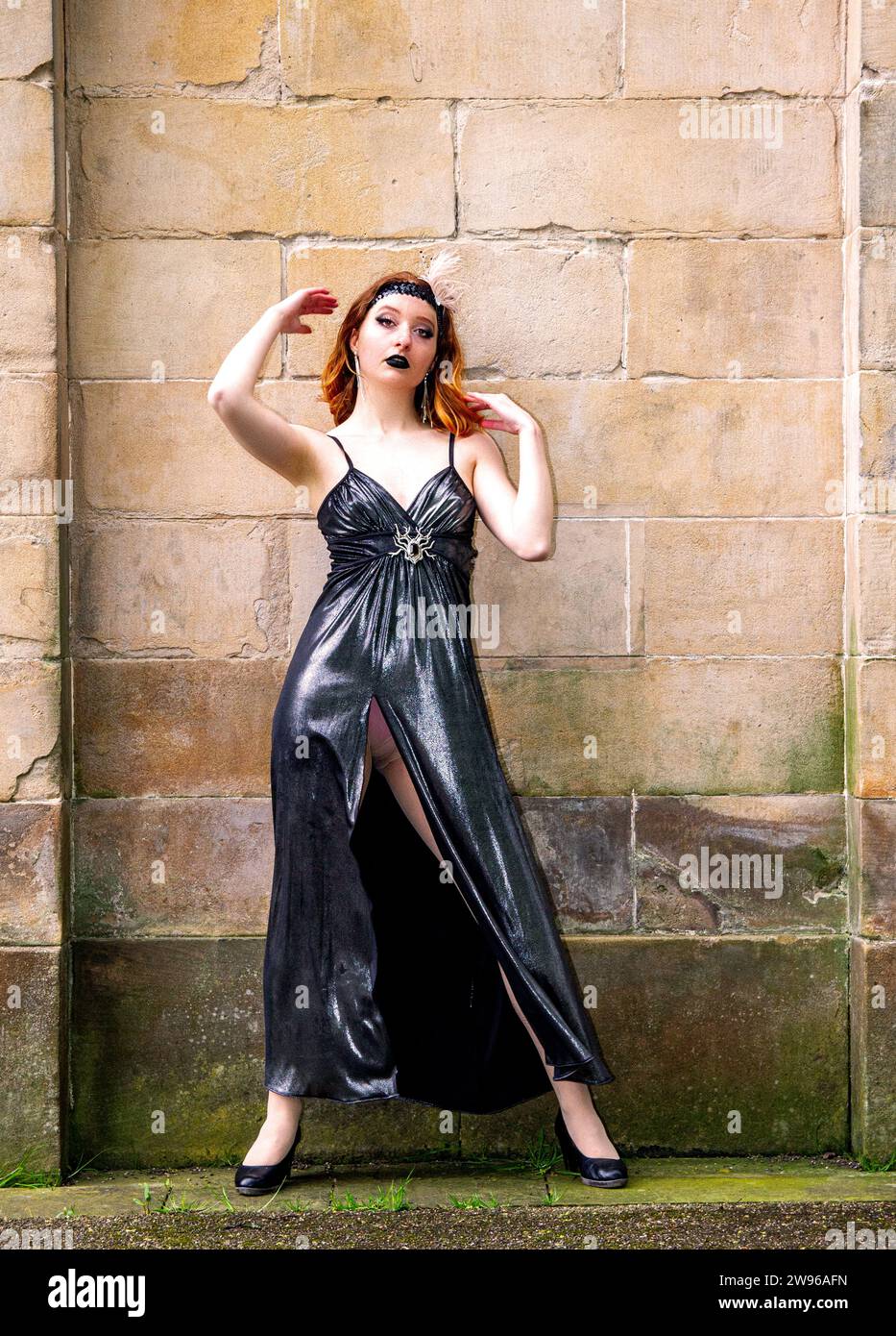 Ashley Wilkinson wearing a 1930`s style dress while modelling an Agatha Christie's Belgium detective Hercule Poirot theme at Baxter Park in Dundee, UK Stock Photo